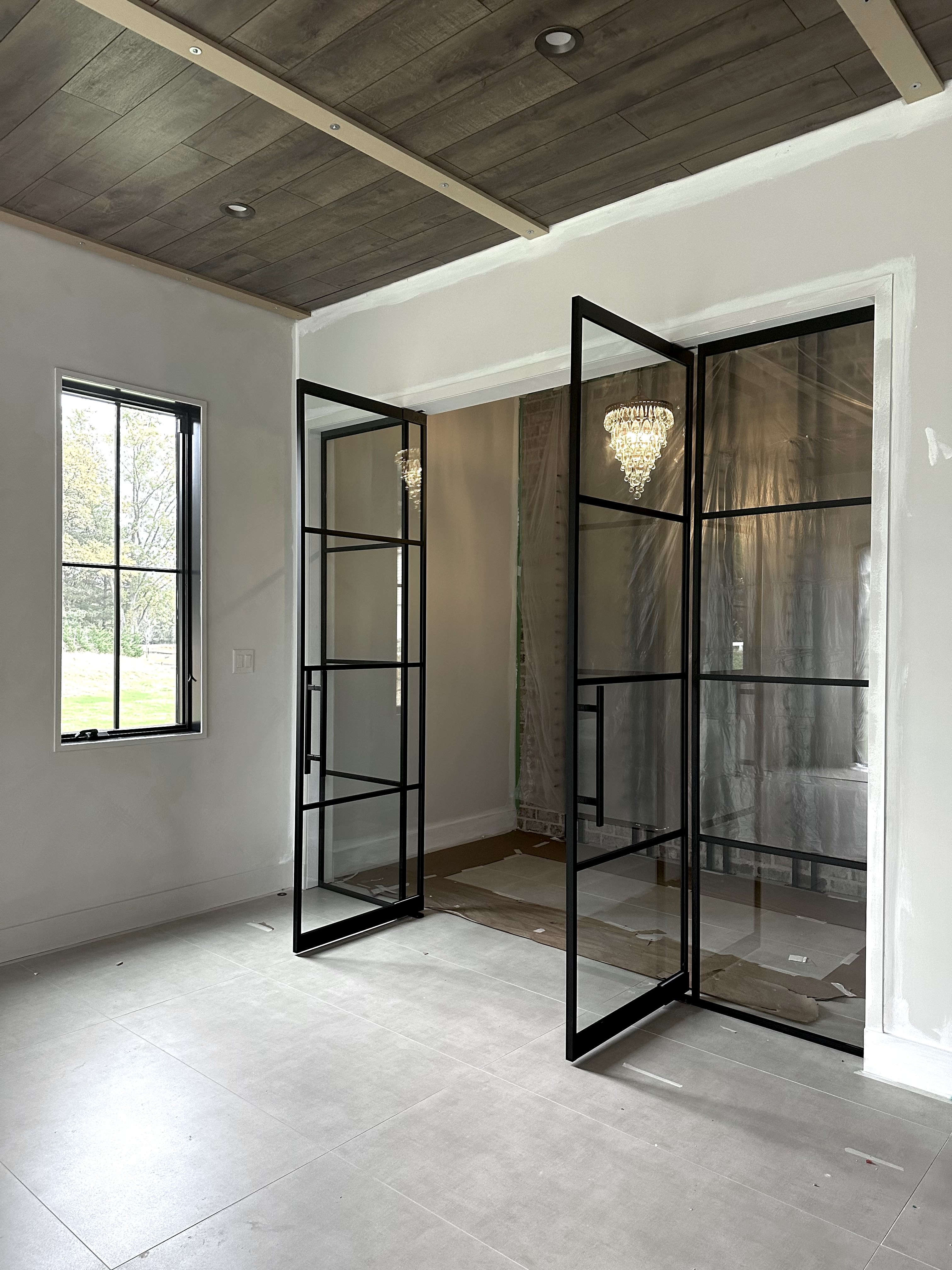 Custom double swinging glass doors open at 90 degrees by WiseGlass NY
