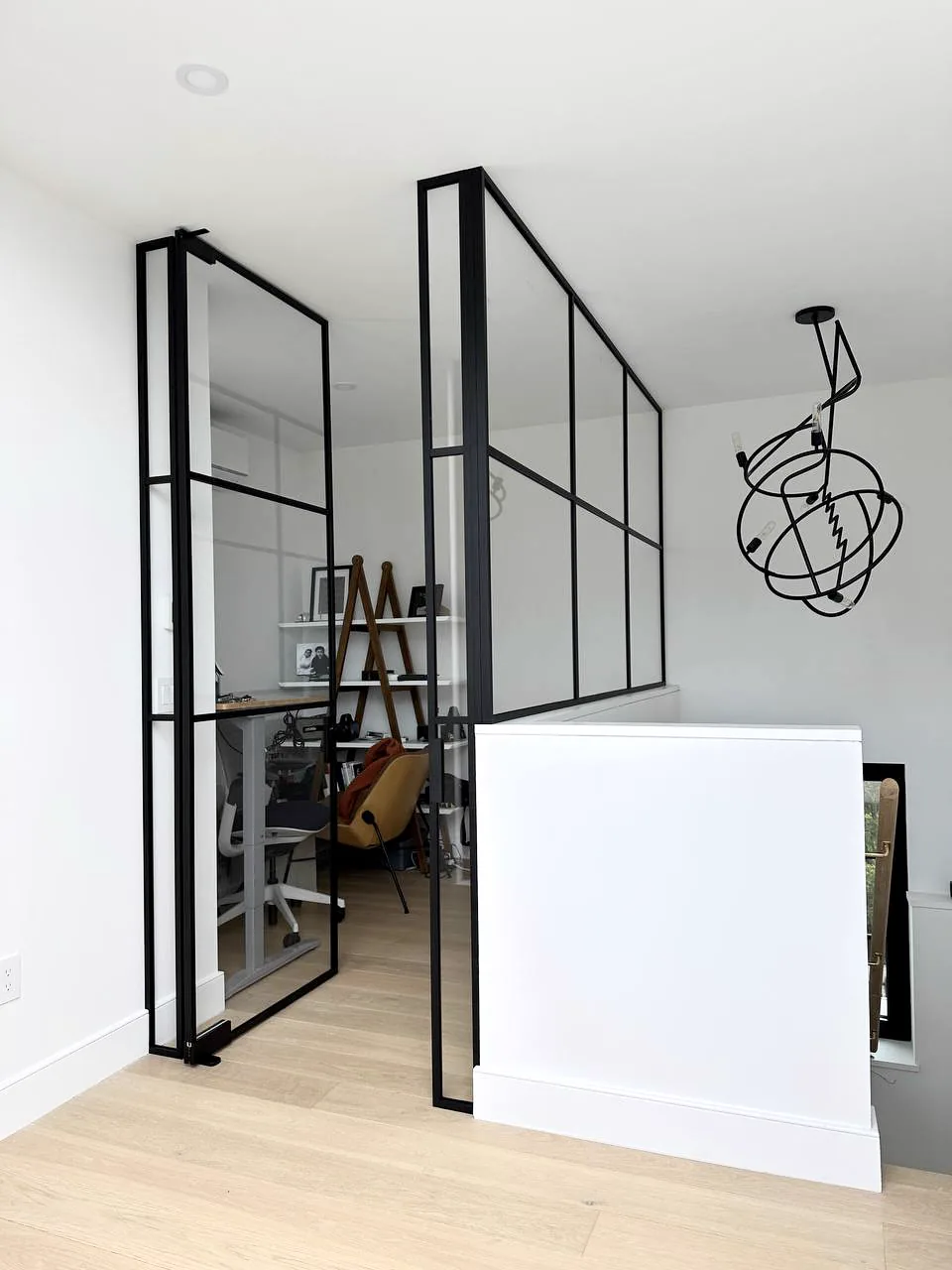 Single swing glass door with matching glass half-wall on pony wall by WiseGlass NY