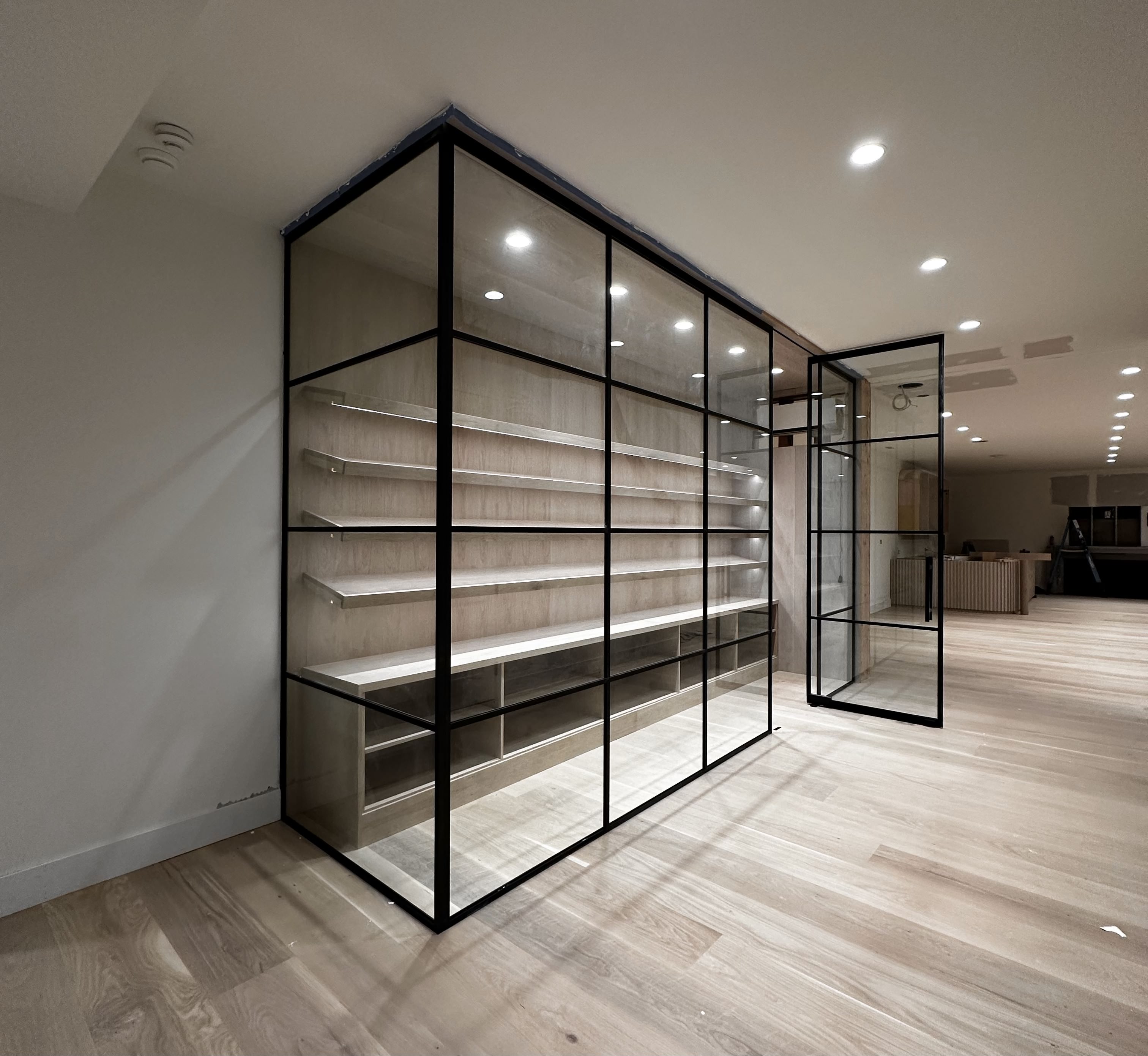 Single swinging glass door with partition wall by WiseGlass NY